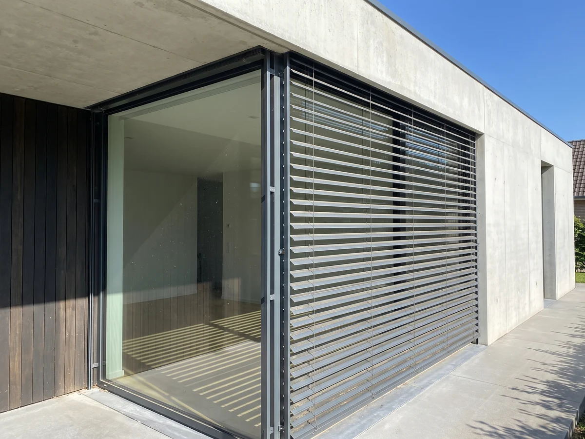 External façade venetian blinds with aluminium slats on a modern window